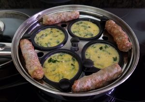 Button scrambled eggs with sausage in steamer