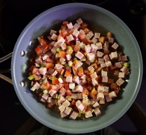 Cubed ham with tomato and spring onions